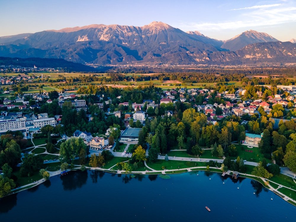 an aerial view of a city with mountains in the background