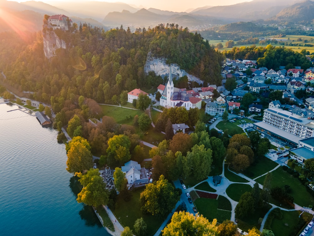 an aerial view of a small town near a body of water