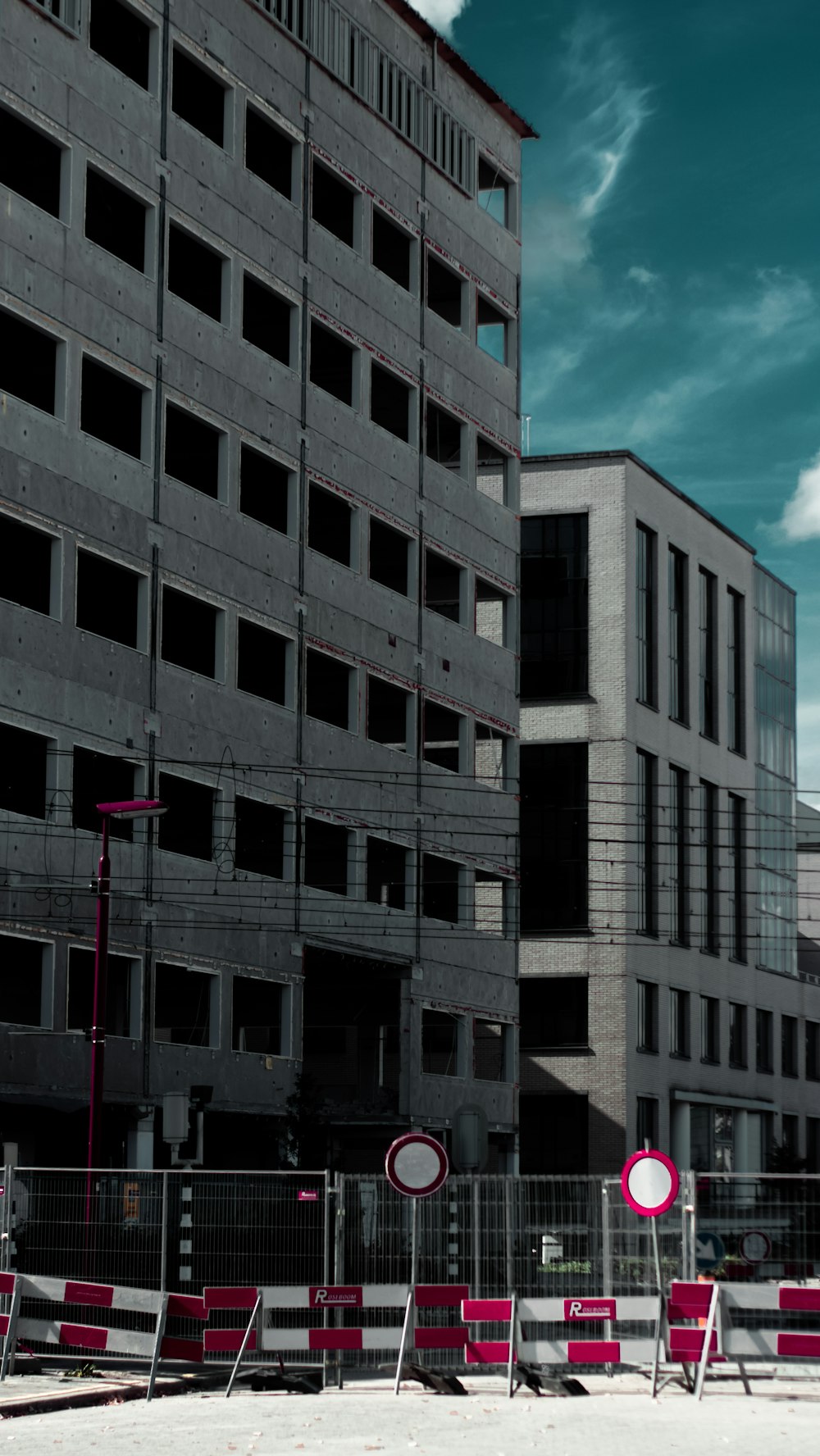 a building that has a bunch of red chairs in front of it