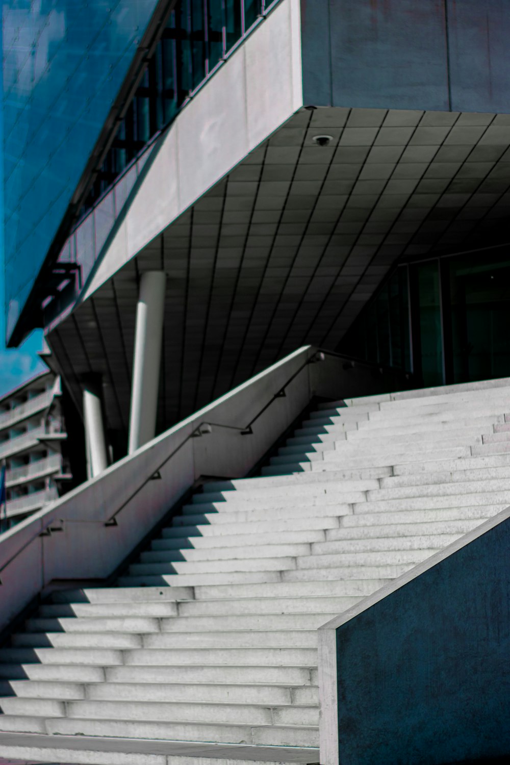 a man riding a skateboard down a flight of stairs