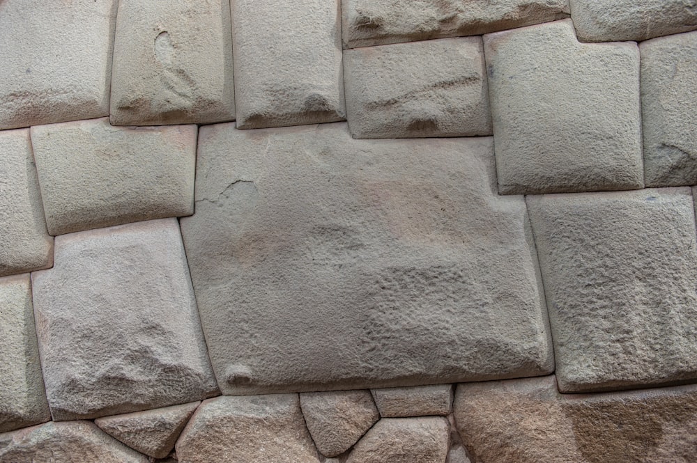 a close up of a wall made of rocks