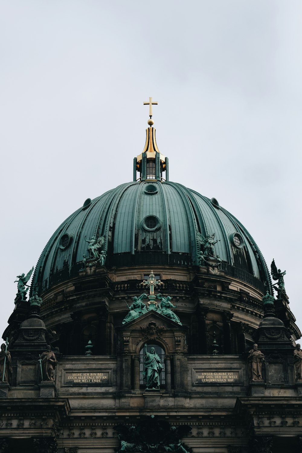 a large dome with a cross on top of it
