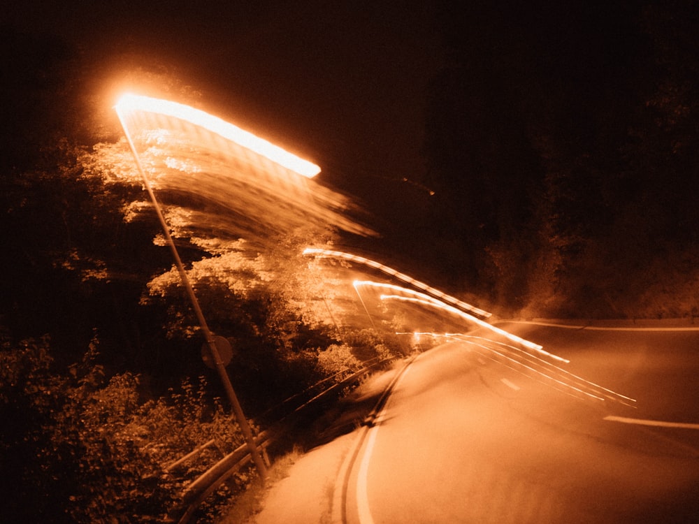 a car driving down a road at night