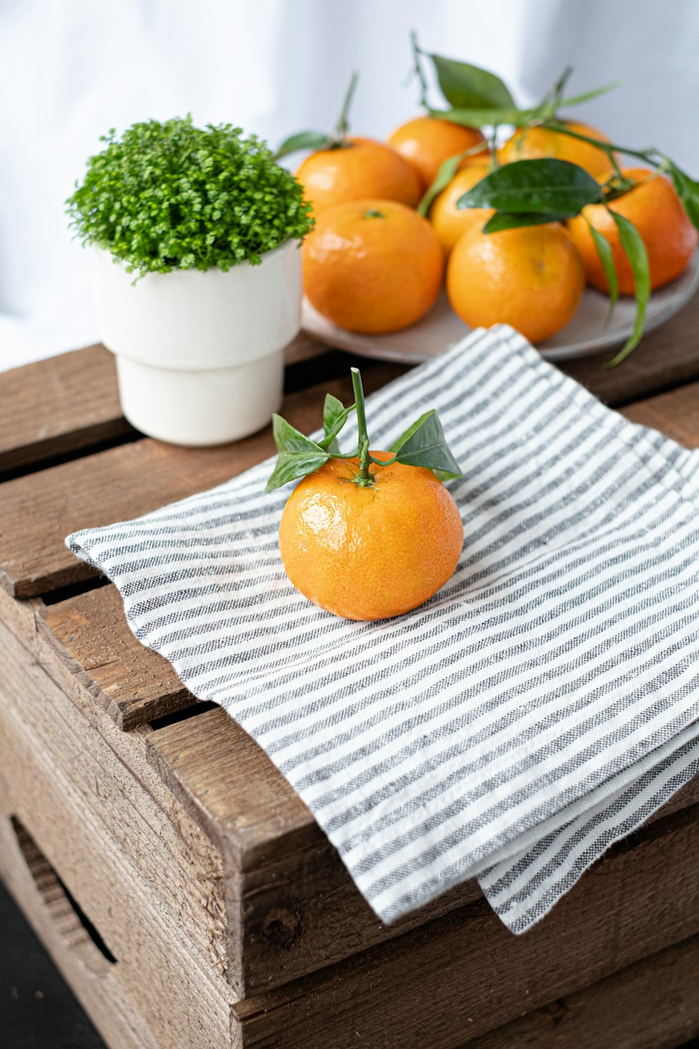 a bunch of oranges sitting on top of a wooden table