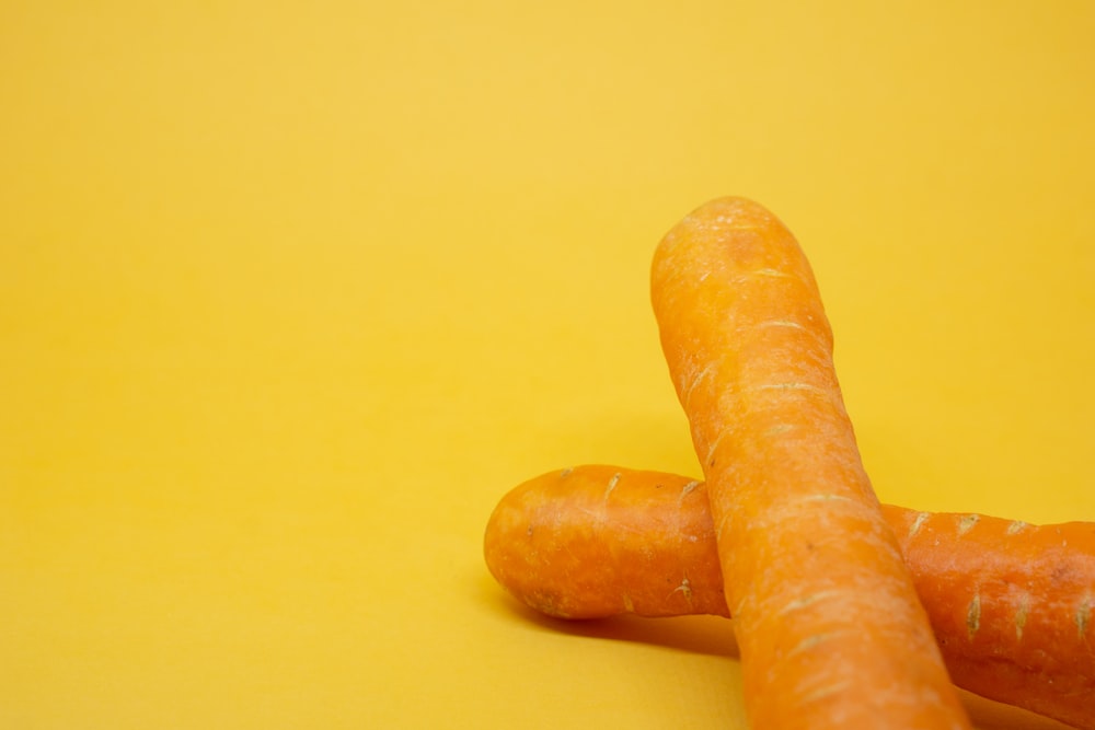 a couple of carrots laying on top of each other