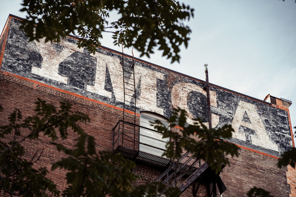 an old sign on the side of a building