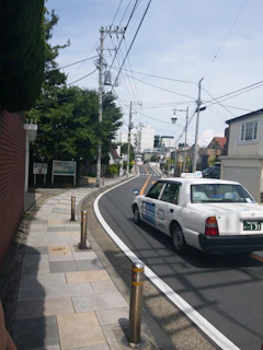 A city youth cab navigating smoothly through New Mexico streets under clear skies.