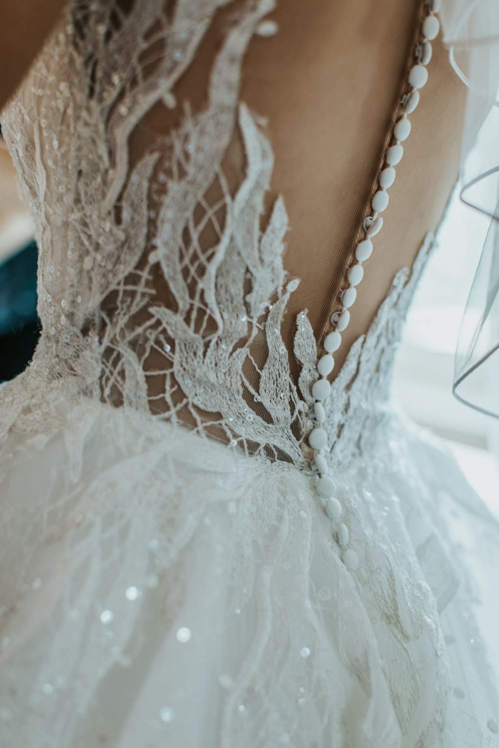the back of a wedding dress with pearls