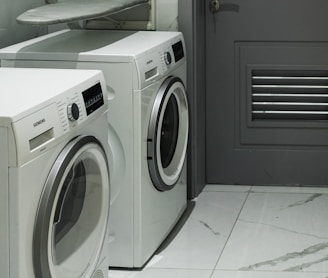 a washer and dryer sitting next to each other