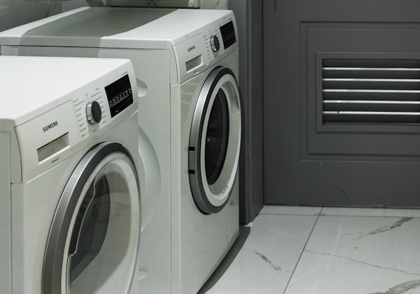 a washer and dryer sitting next to each other