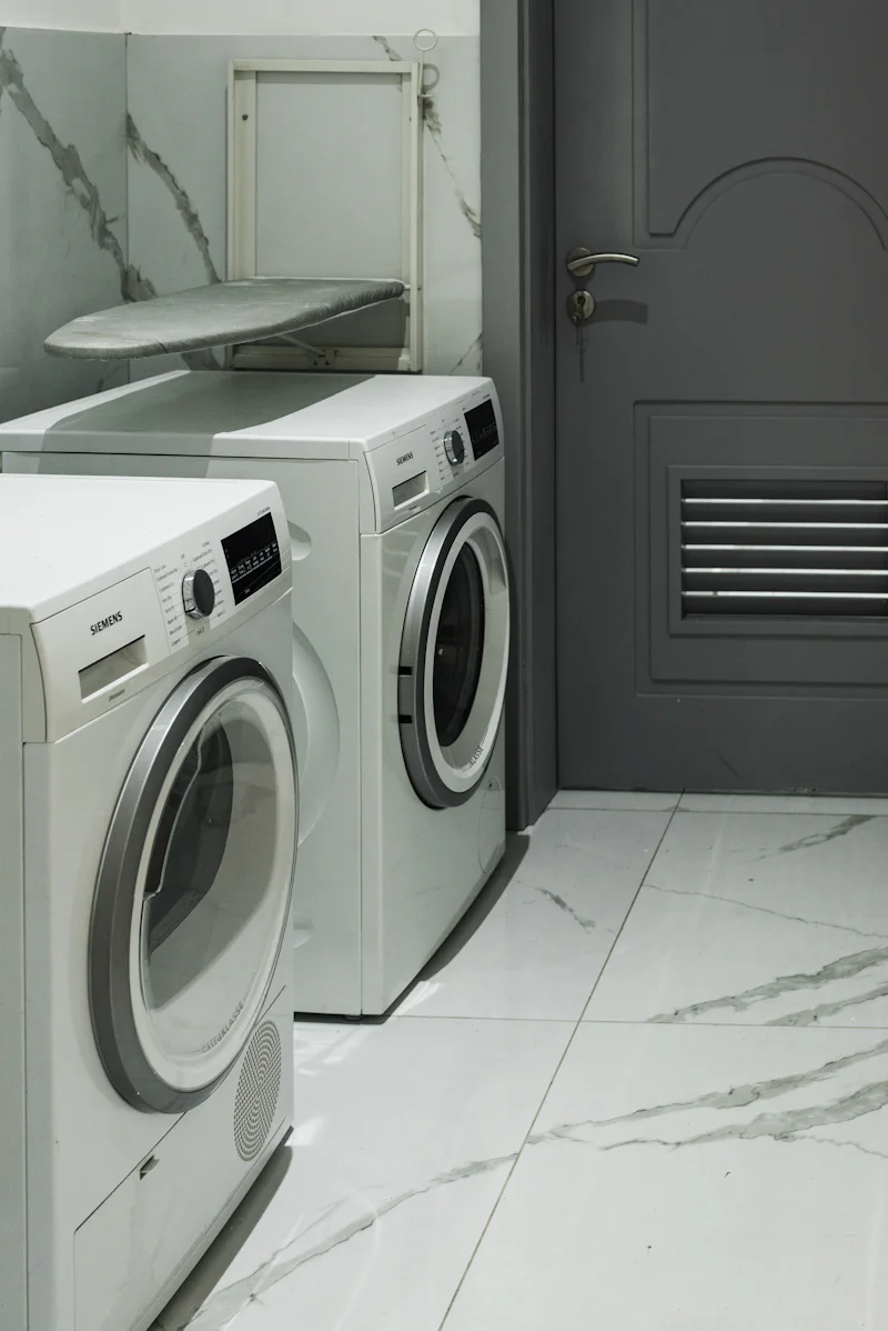 A washer and dryer sitting next to each other