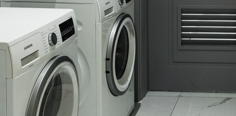 a washer and dryer sitting next to each other