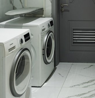 a washer and dryer sitting next to each other