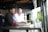 A happy couple reviewing their car insurance documents in a bright office.