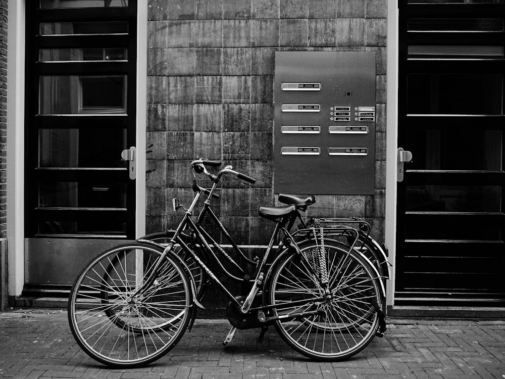 a couple of bikes parked next to a building