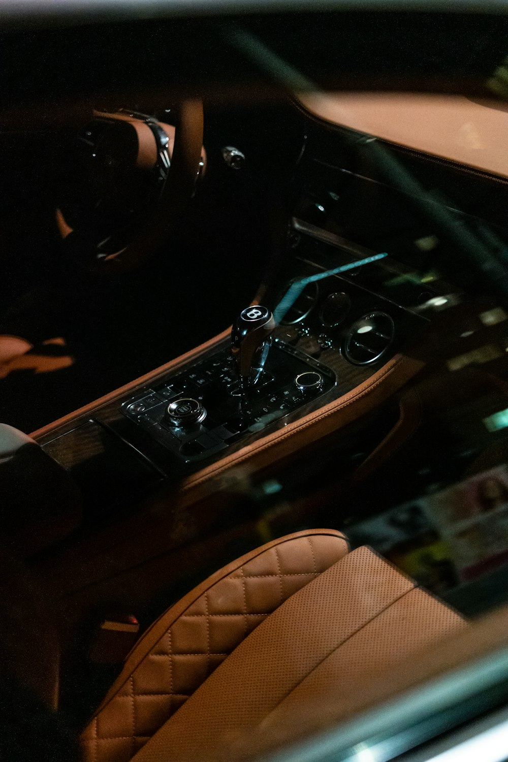 the interior of a car with a steering wheel and dashboard