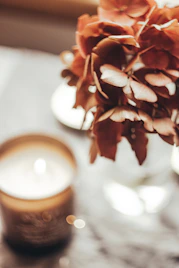 a close up of a candle on a table
