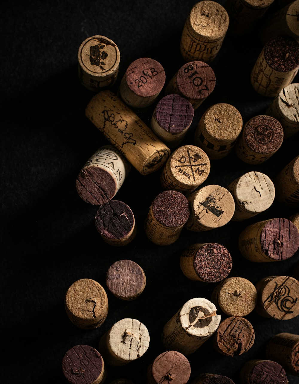a bunch of wine corks sitting on top of a table
