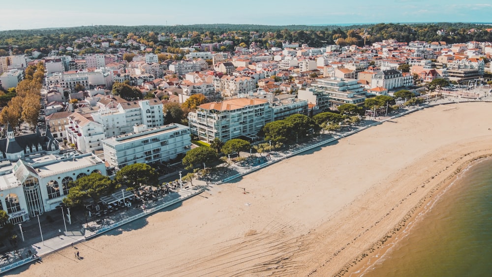 an aerial view of a beach and a city