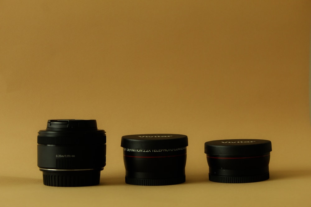 a camera lens sitting next to another camera lens