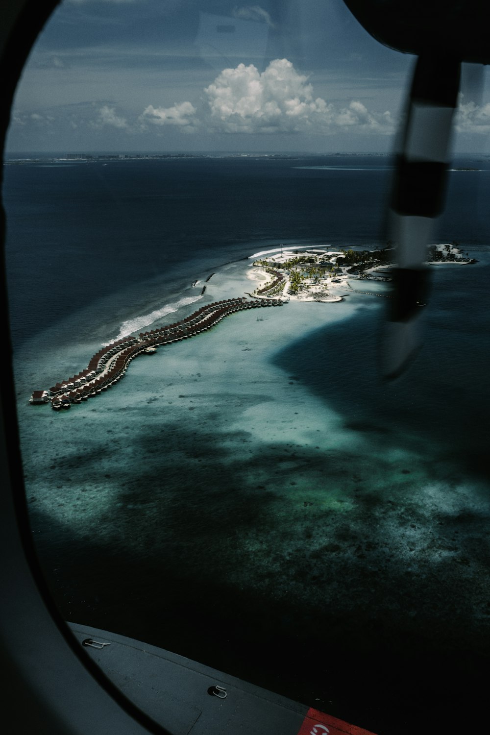 a view of an island from an airplane window