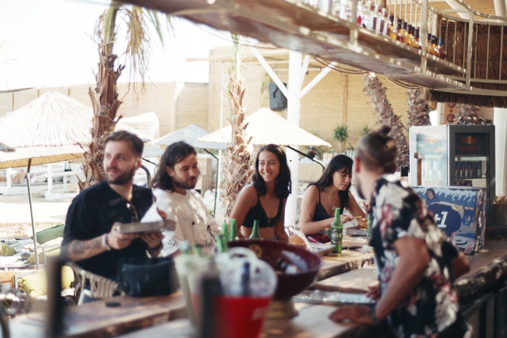 a group of people sitting around a table