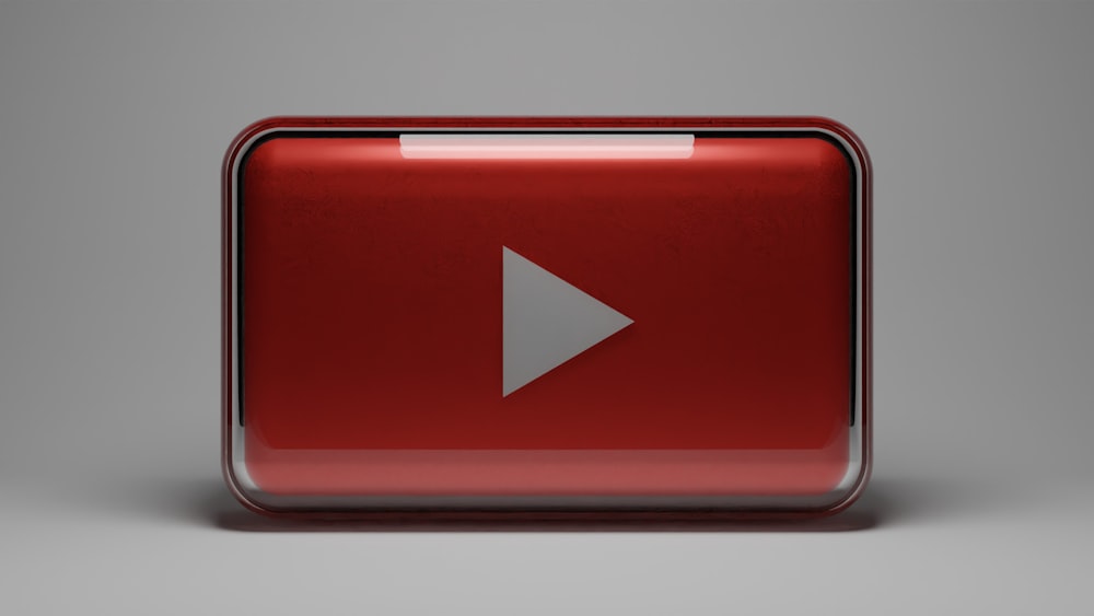 a red play button with a white arrow