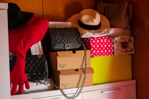 A neatly organized shelf filled with colorful accessories and bags.