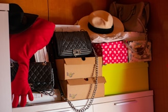 Shelves filled with a variety of hats and handbags under warm lighting