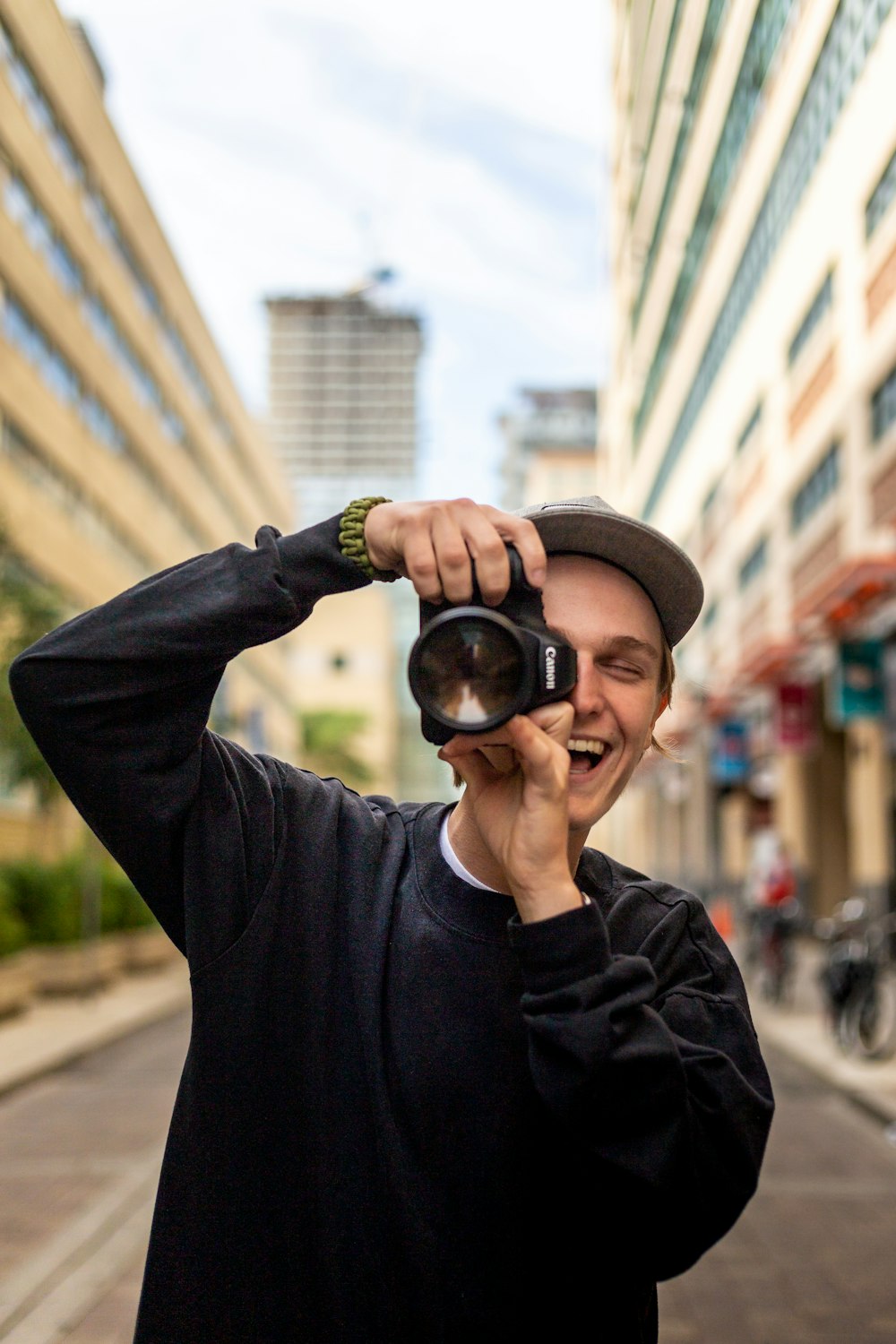 a man holding a camera up to his face