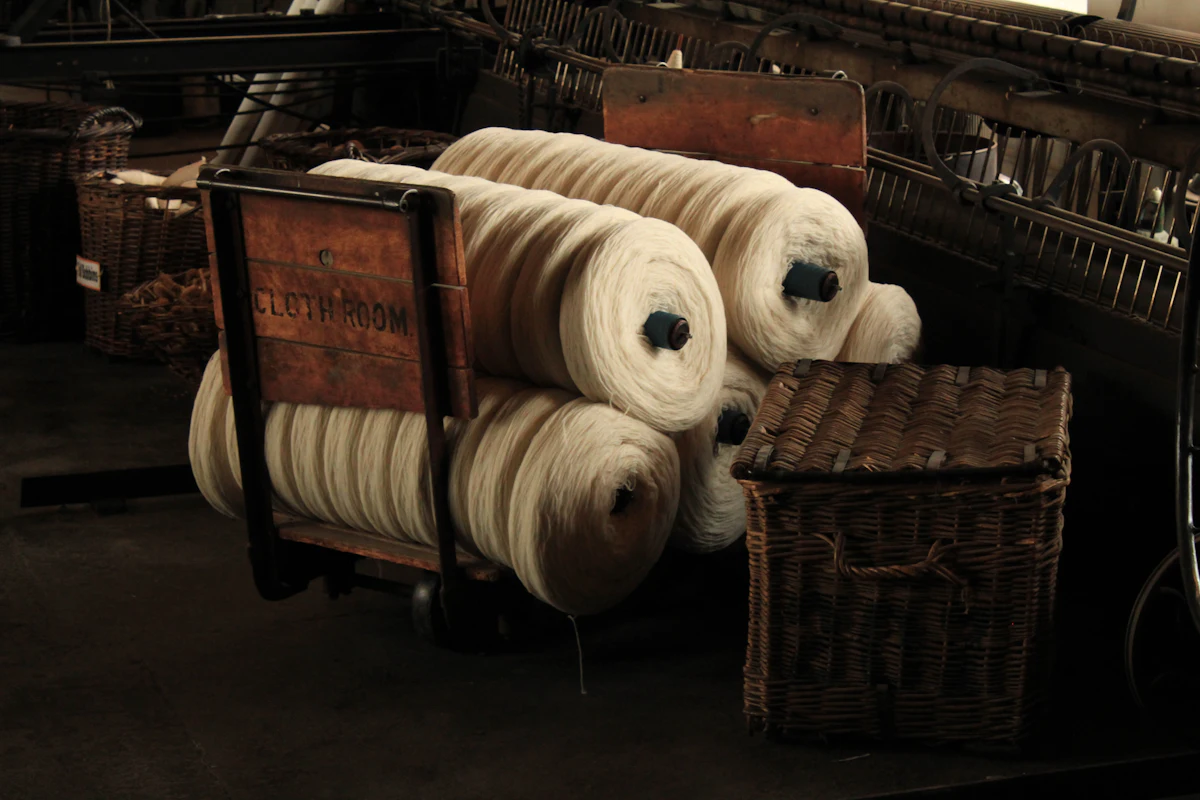Rolls of yarn on a wooden cart
