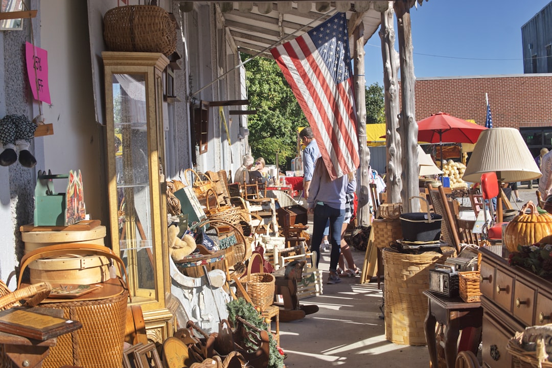 a man walking down a street next to a store,