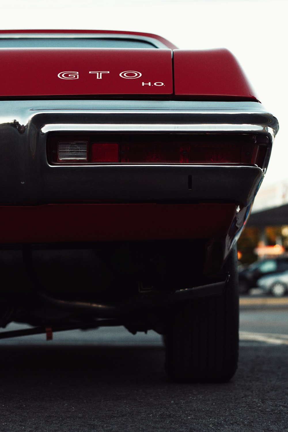 a close up of the rear end of a red car