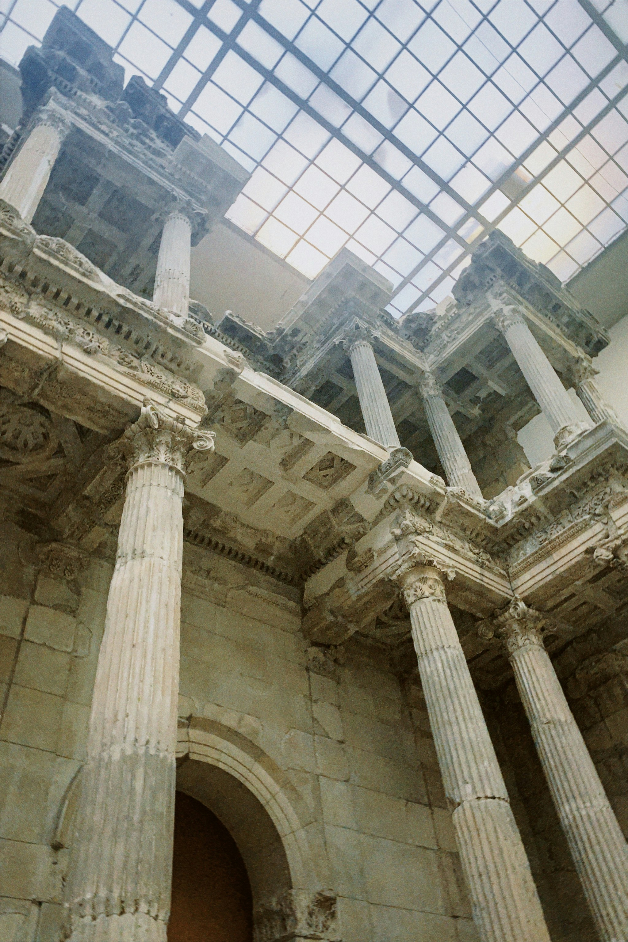 a large building with columns and a skylight