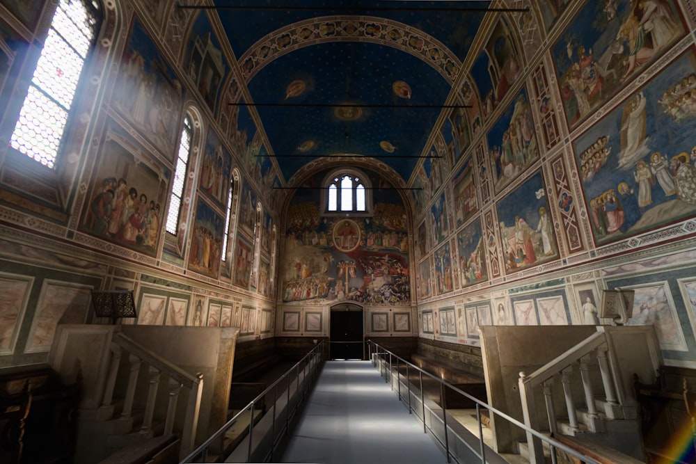 a long hallway with paintings on the walls