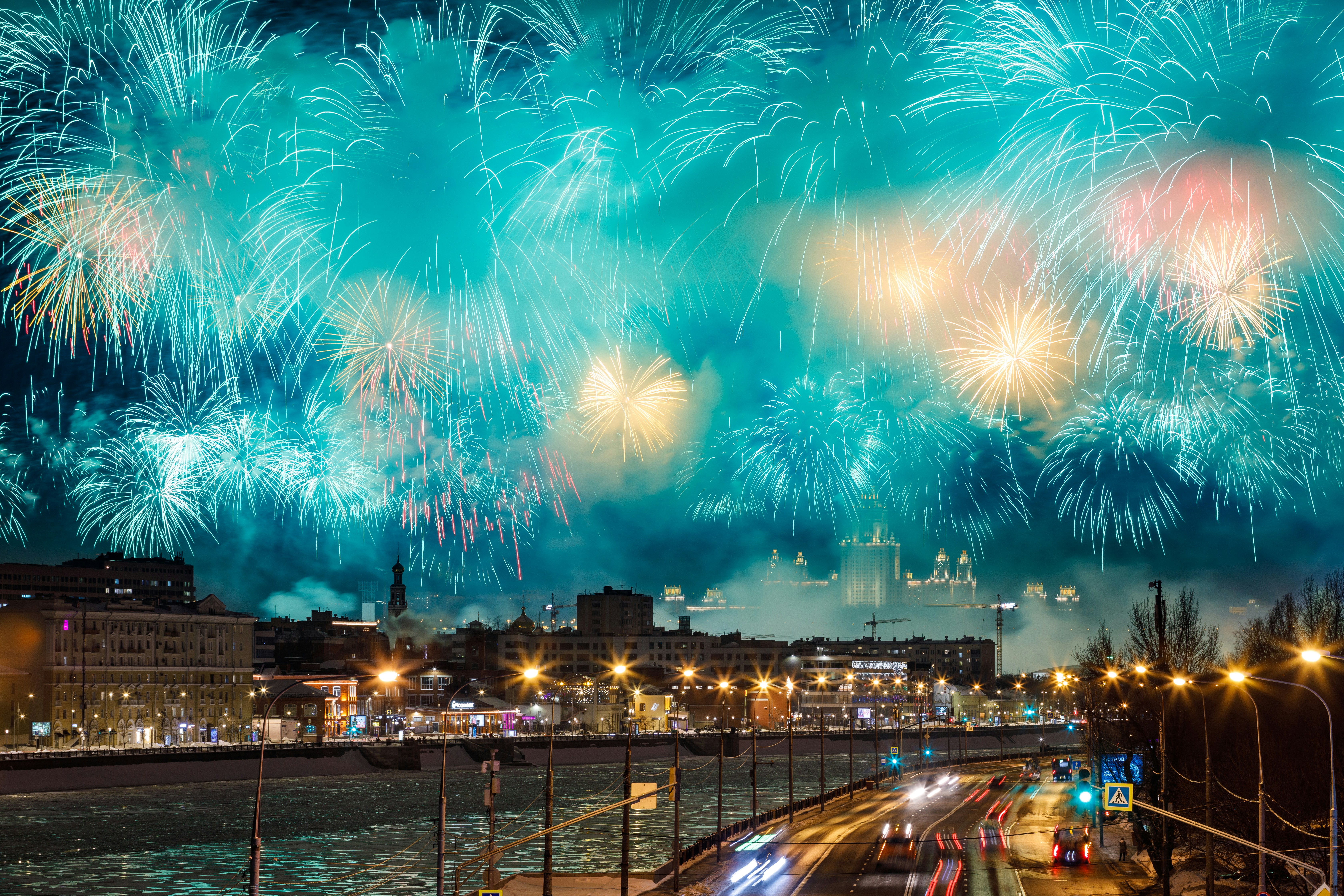 a large fireworks display over a city at night