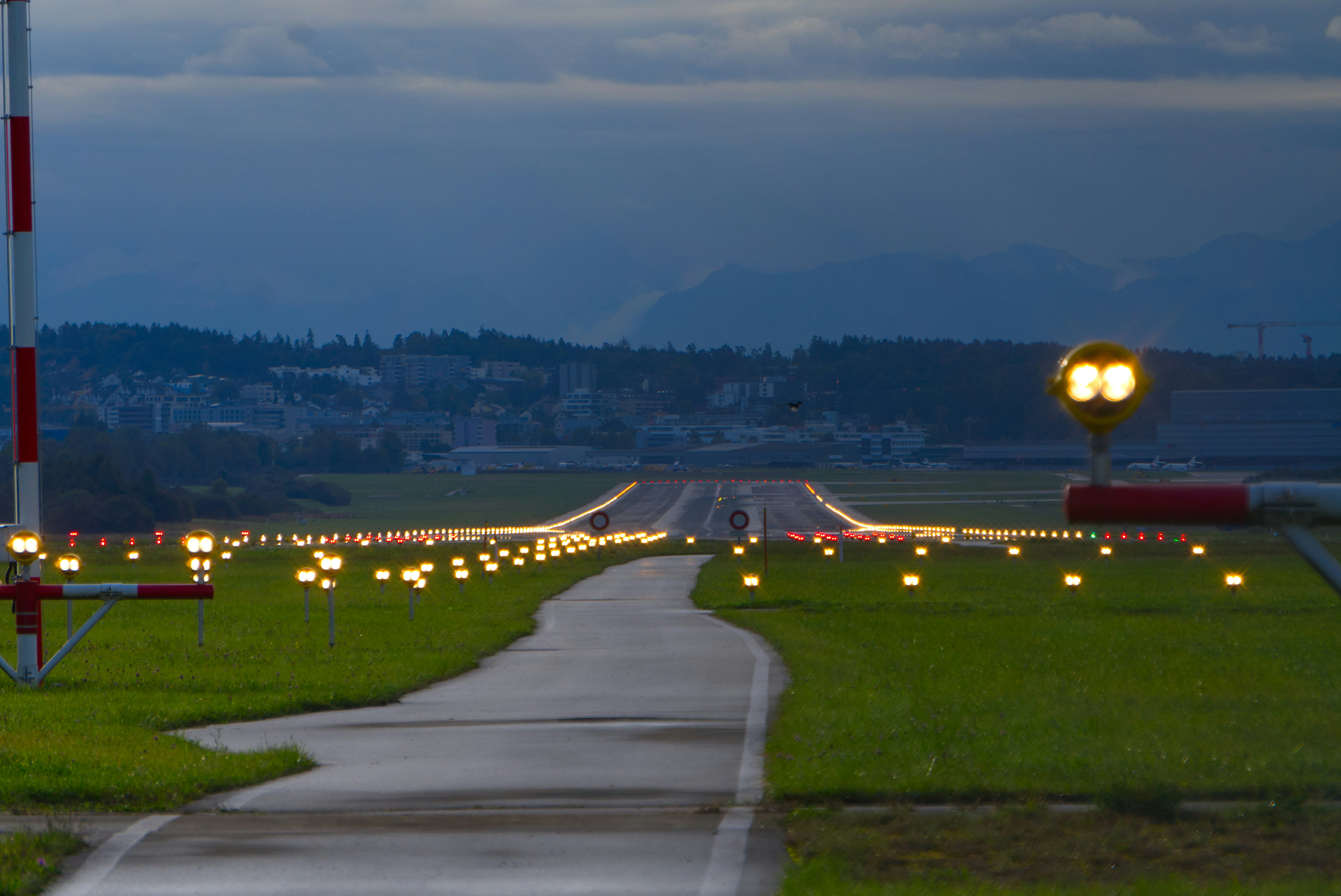 a long road with many lights on it, 