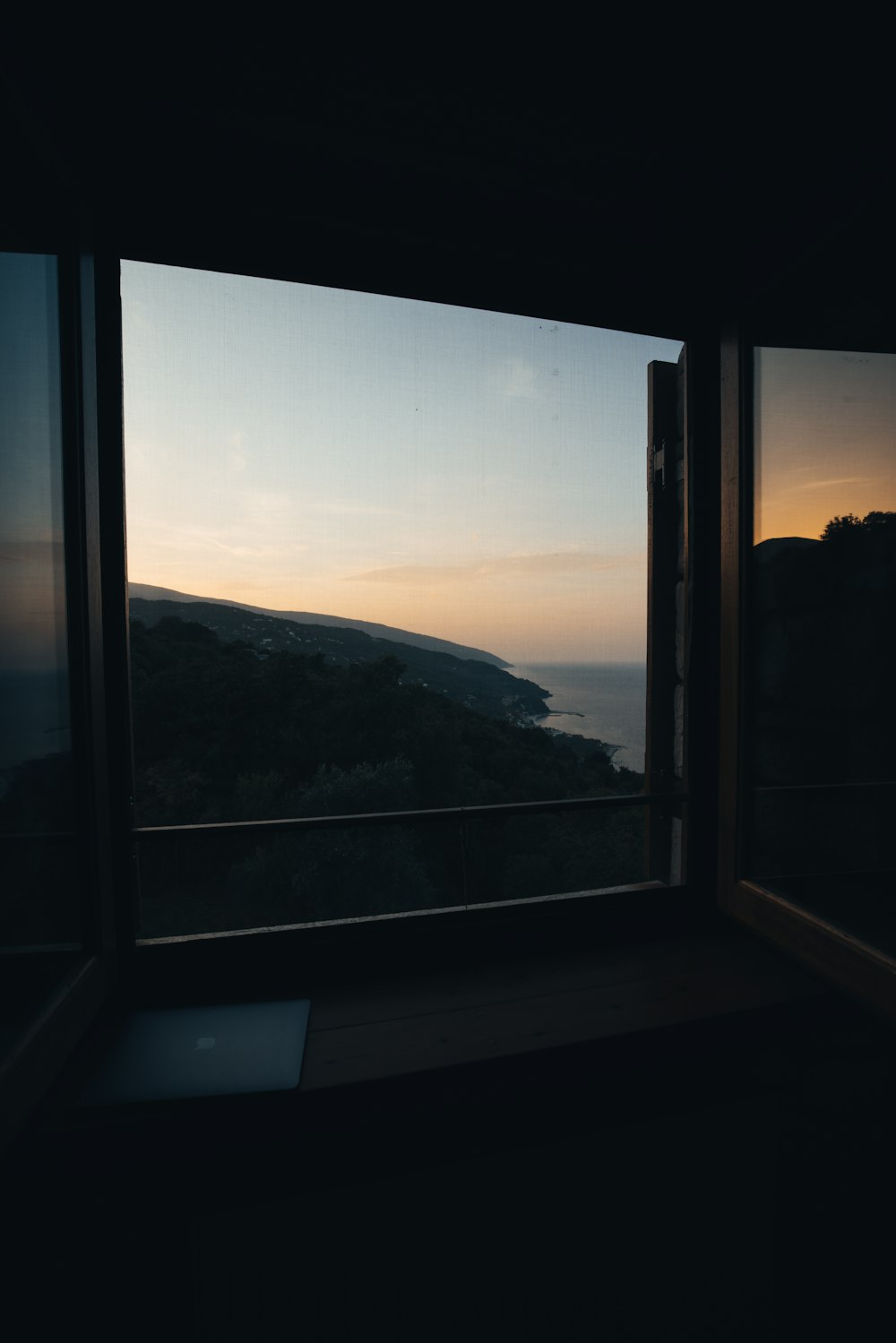 a window with a view of the ocean