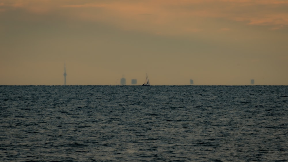 a group of boats floating on top of a large body of water