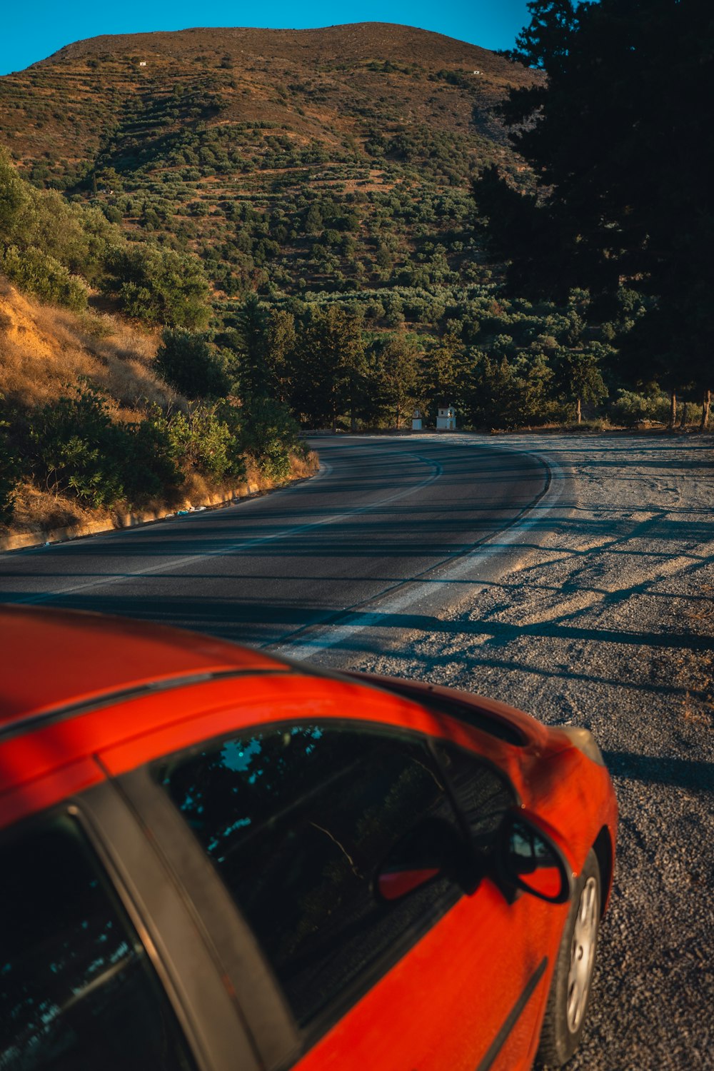 a car parked on the side of a mountain