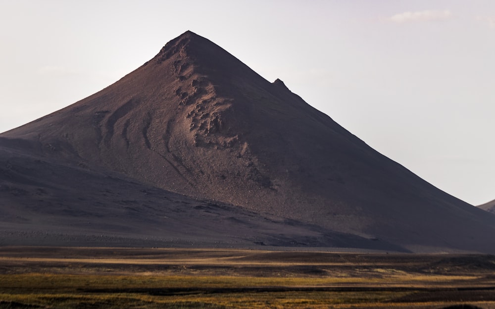 a large mountain in the background