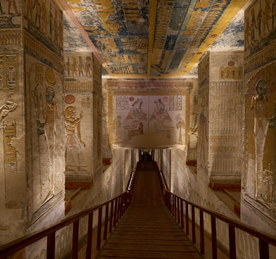 a long hallway with paintings on the walls