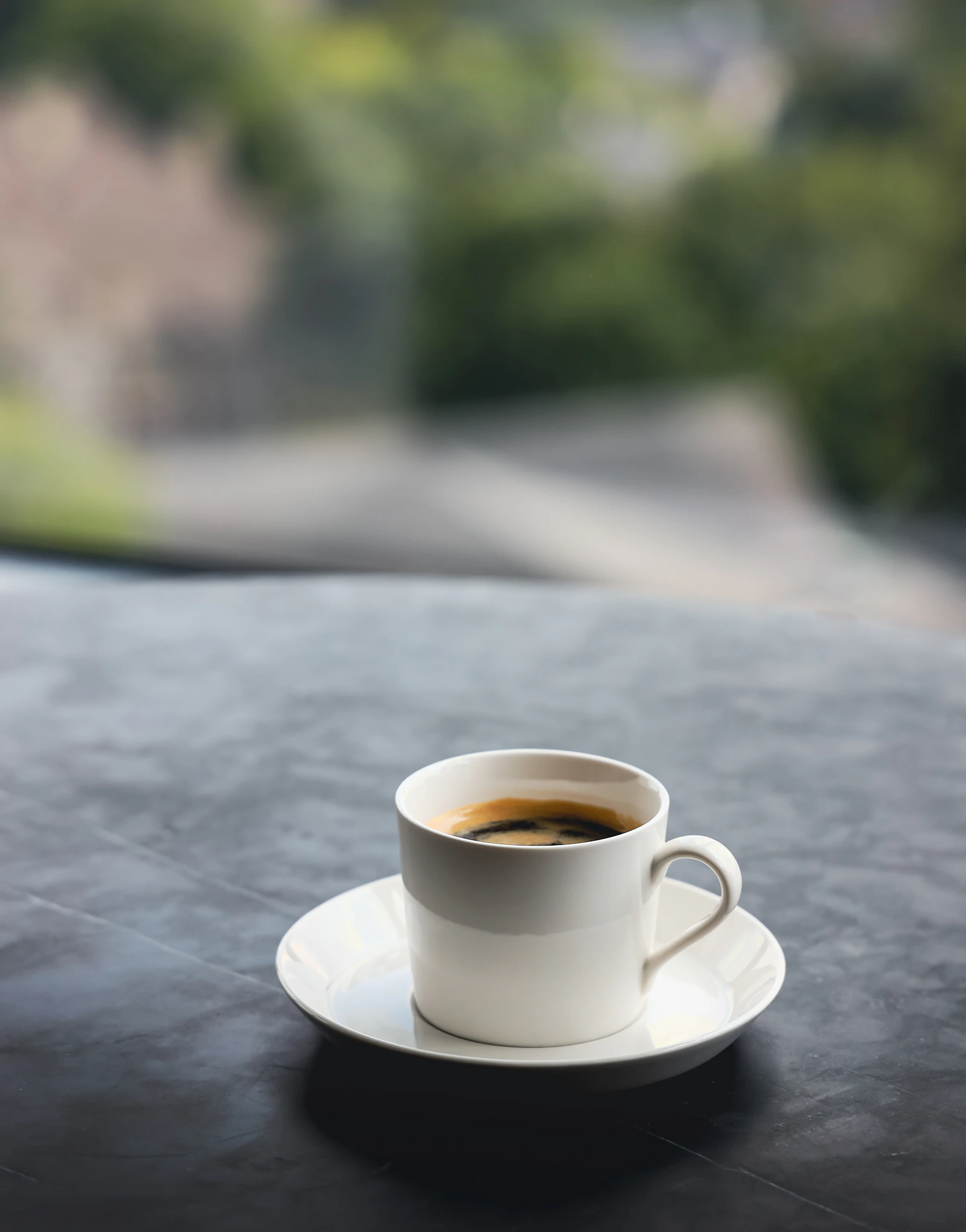 A quiet coffee moment beside a sunlit window