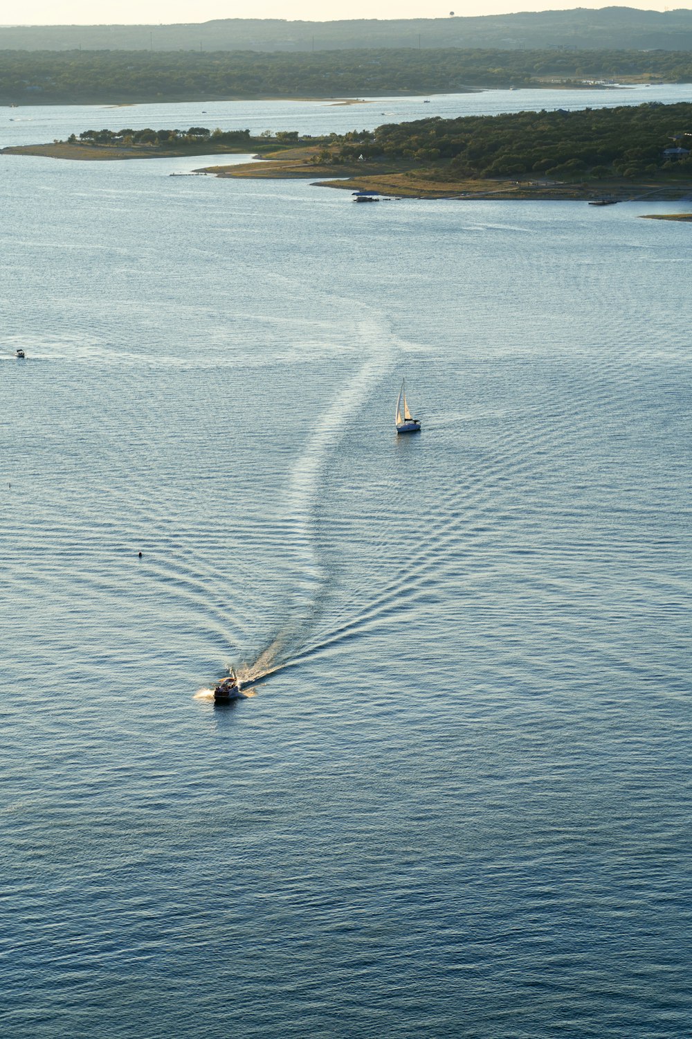 a boat is traveling across a body of water