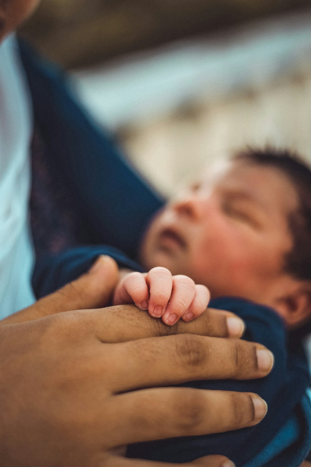 a man holding a baby in his arms