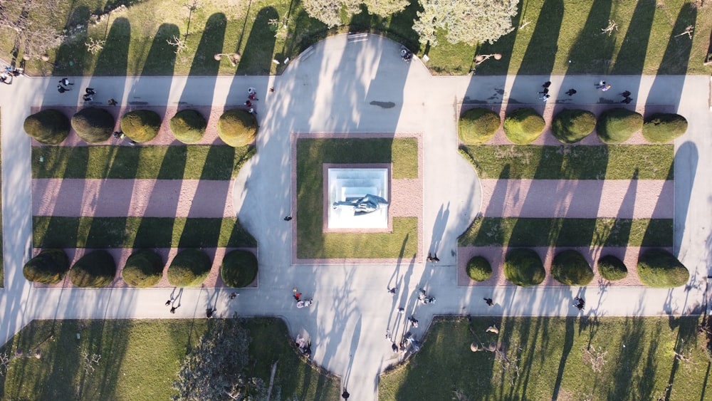 an aerial view of a park with trees and benches