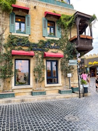 Charming restaurant corner with rustic decorations and hanging plants.