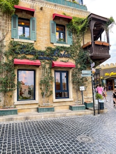 Charming restaurant corner with rustic decorations and hanging plants.