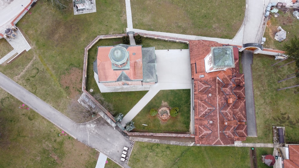 an aerial view of a building with a clock tower