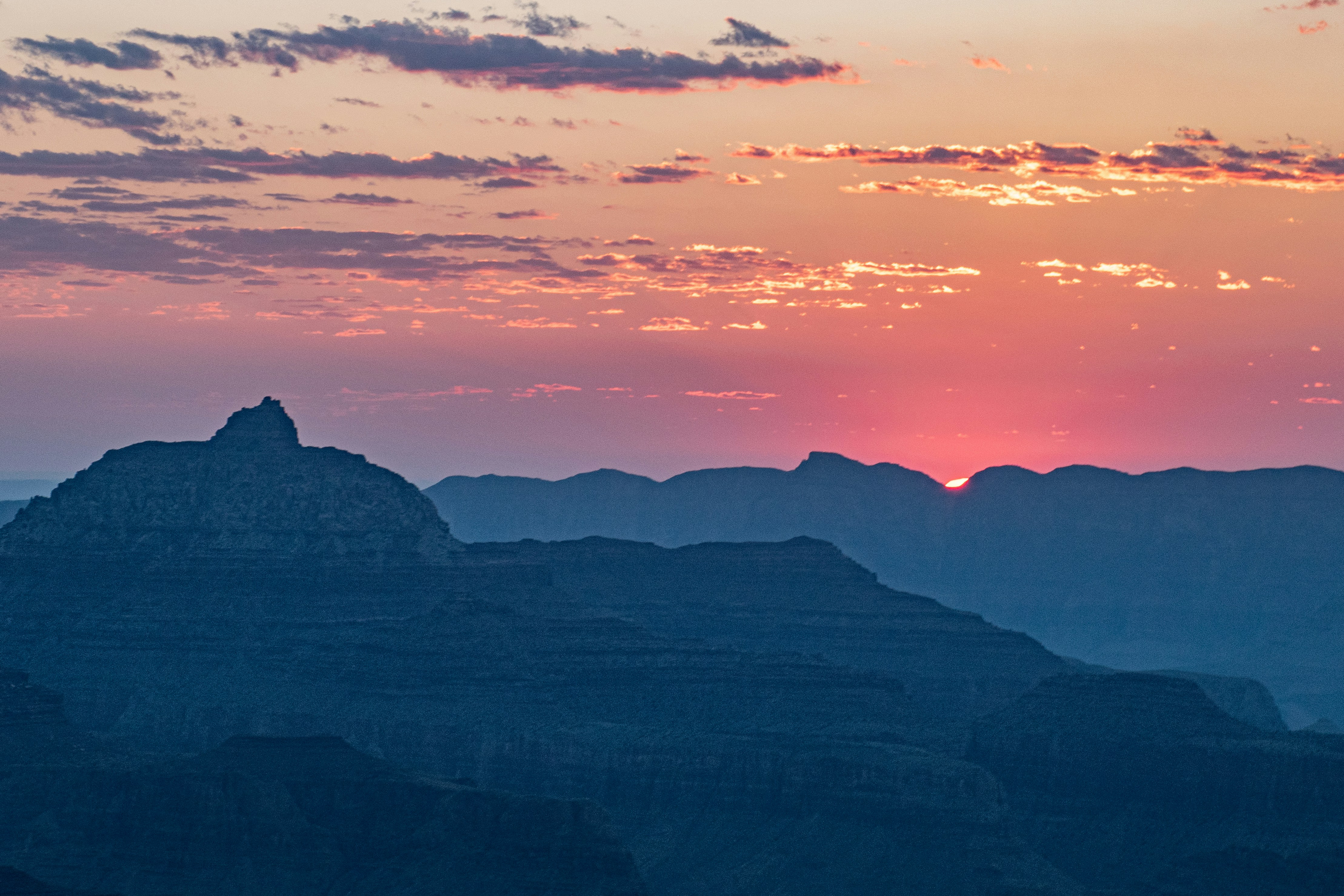 The sun is setting over the mountains in the desert photo – Free Sunset ...